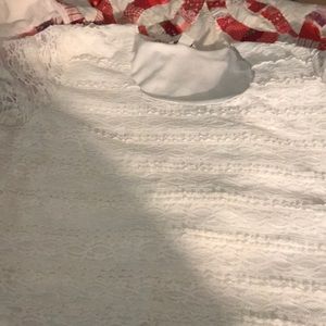 Lace covered silk top.